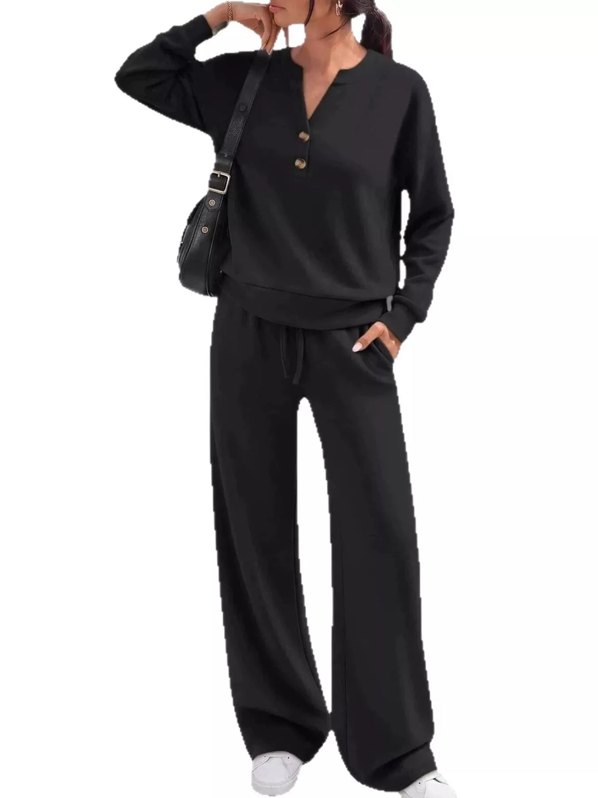 Women's black two-piece matching set with button-detail top and wide-leg pants