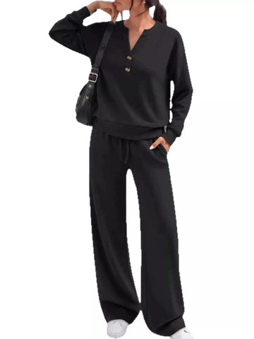 Women's black two-piece matching set with button-detail top and wide-leg pants